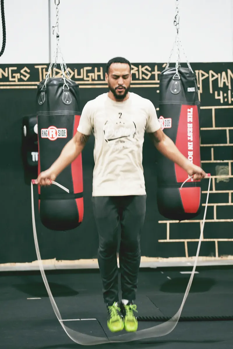 Jeremiah jumping rope between two heavy bags